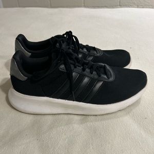 Adidas women’s size 9 black athletic shoes.